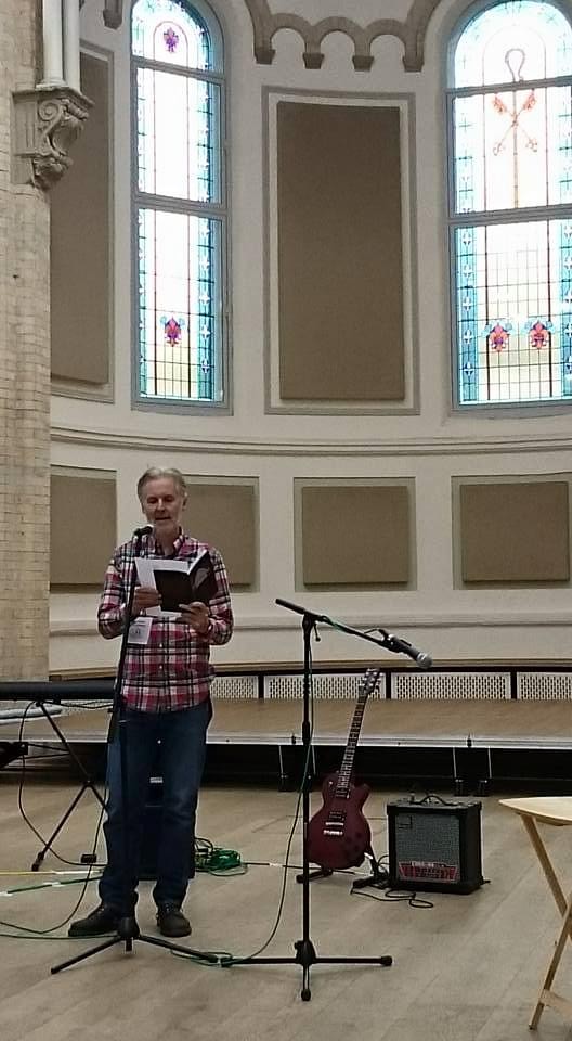 Andy Hickmott reading his poems at Halle St Peter’s.